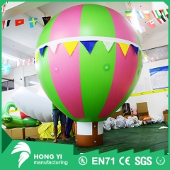 Giant spacer color inflatable hot air balloon model inflated to the earth