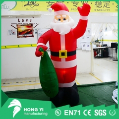Inflatable cartoon Santa holding a bag with Santa Claus decoration with LED lights